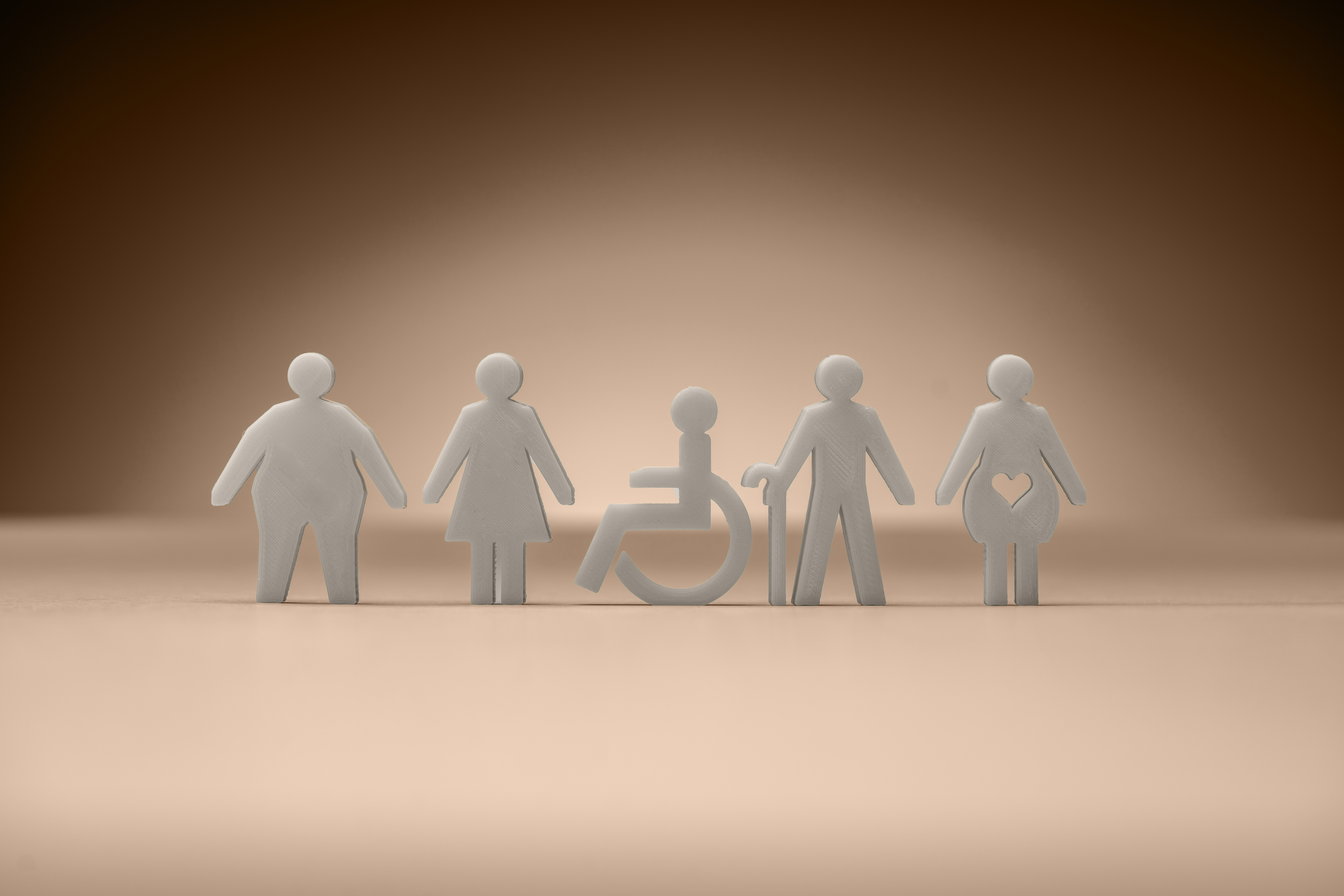 Abstract figures representing diversity, equity and inclusion, including different body types and accessibility