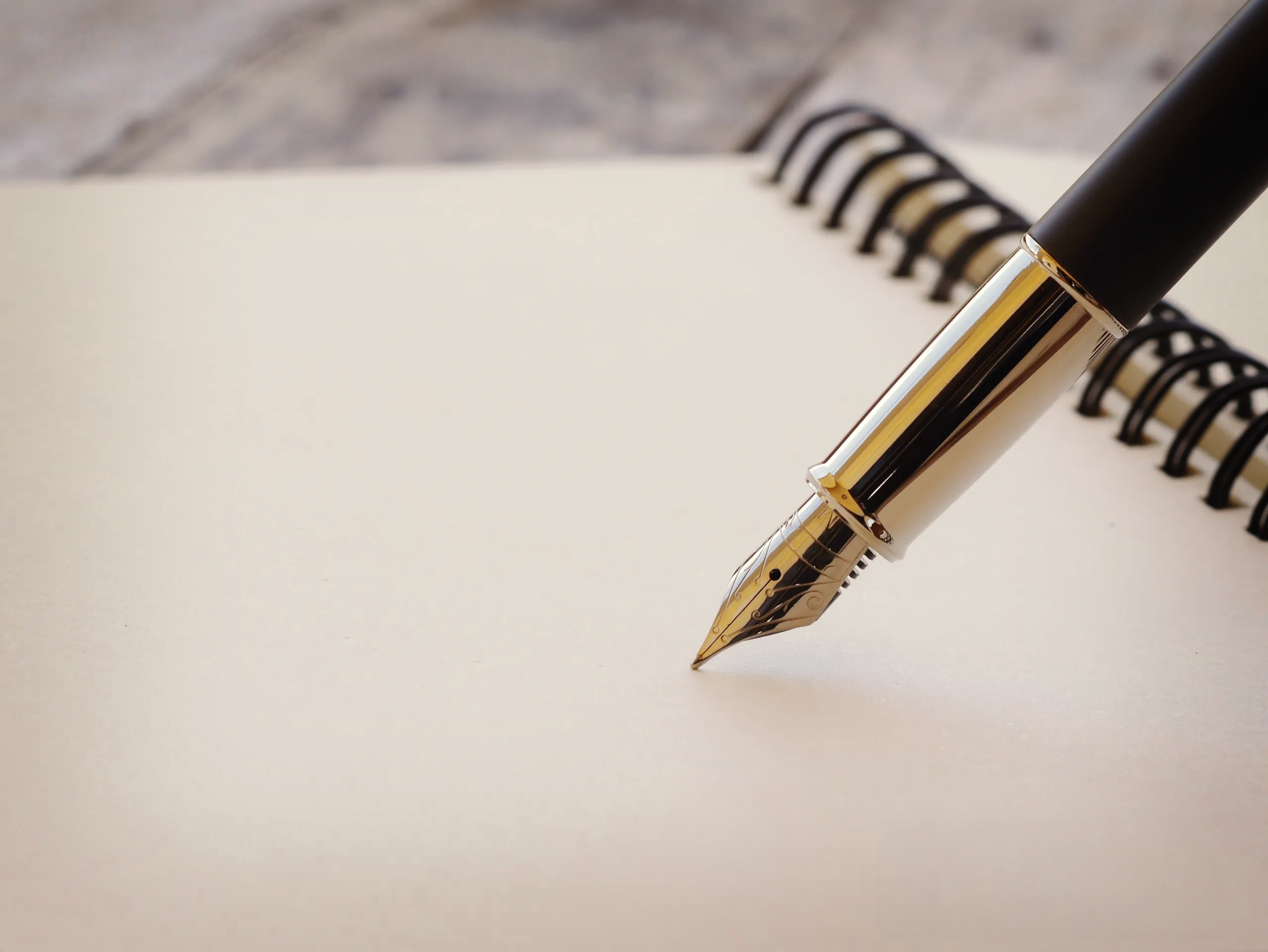 Luxury fountain pen on blank notebook representing structured operational planning